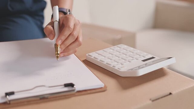 Portrait of Starting small businesses SME owners, two Asian woman check online orders Selling products working with boxs freelance work at home office, sme business online small medium enterprise