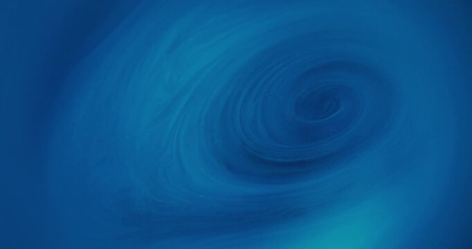 Defocused ink whirl. Blue art texture. Bright color marble water pigment round shimmer acrylic droplet twirl on abstract background.