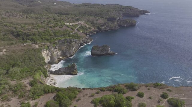 Aerial view of the cliffside coastline and beaches of Penida Island, Indonesia