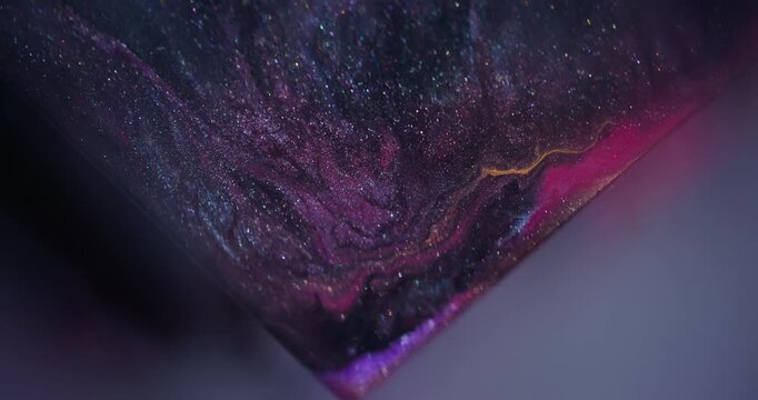 Marble fluid. Paint spill. Blur purple pink blue color triangle glitter blend sparkling texture floating on abstract art background.
