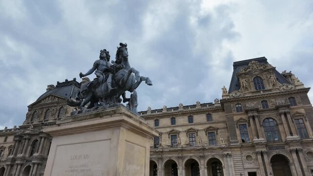 Louis XIV Equestrian Statue and Louvre Museum in Paris