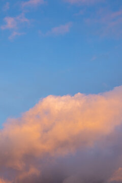 Pink Sunset Clouds in Blue Sky