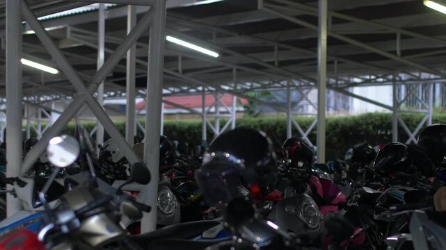 Crowded Covered Motorcycle Parking Lot Under Steel Truss Roof
