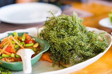 Sea grape seaweed served with som tum Thai © Dontree