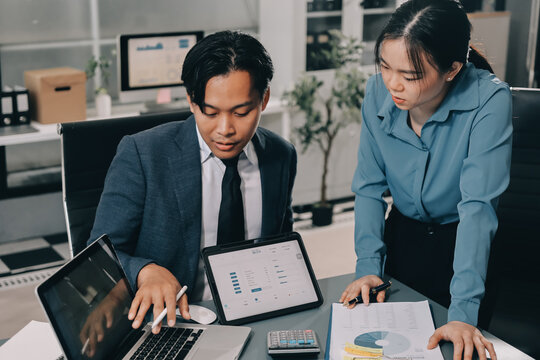 Business professional analyzing financial data on digital tablet dashboard with calculator and laptop, representing accounting software, ERP system integration, performance monitoring.
