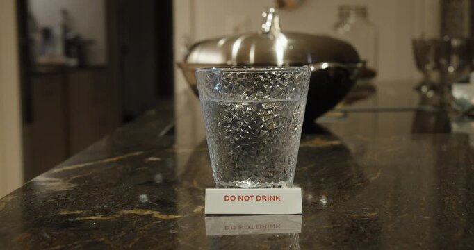 Do Not Drink Warning on Glass of Unsafe Water