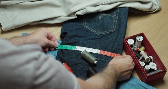 Fashion Designer Measuring Clothes, close up