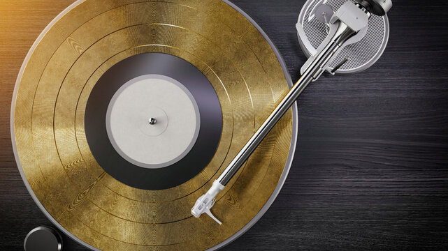 Golden vinyl record on modern turntable.