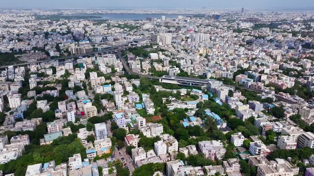 dense urban with Madhura Nagar metro station and SMT. DURGABAI DESHMUKH WOMENS TECHNICAL TRAINING INSTITUTE at hyderabad, telangana, india. day time, push back shot, drone shot, 4k.