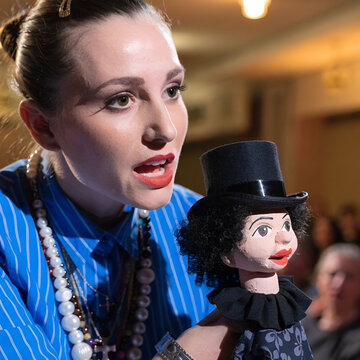 portrait of female ventriloquist during show