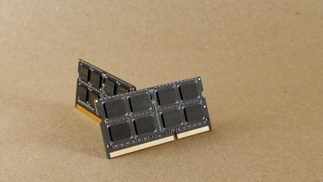 Two computer RAM memory modules displaying advanced technology, providing essential components for data storage and enhancing overall system speed on a neutral background
