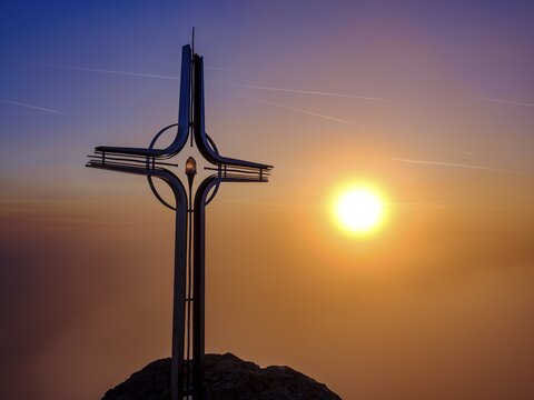 Summit cross Hoher G&ouml;ll in the fog at sunrise, Berchtesgaden National Park, Sch&ouml;nau am K&ouml;nigssee, Berchtesgadener Land, Upper Bavaria, Bavaria, Germany