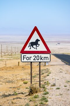 Warning sign wild horses, near L&uuml;deritz, Namibia desert, Karas region, Namibia