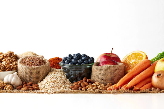 Fresh organic food selection isolated on transparent background with colorful produce, grains, nuts and fruit arranged together. with Clipping path