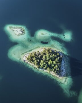 Small island in the Eibsee lake, turtle sinel, drone shot, Garmisch-Partenkirchen, Germany