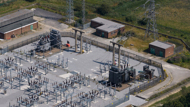 Aerial view of electrical substation and power grid equipment