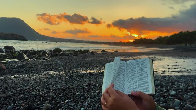 Christian Bible Reading by the Ocean at Golden Hour, Spiritual Meditation, Faith and Hope