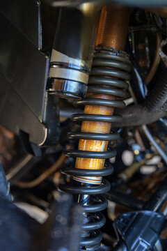 Close-up of motorbike rear shock absorber and suspension