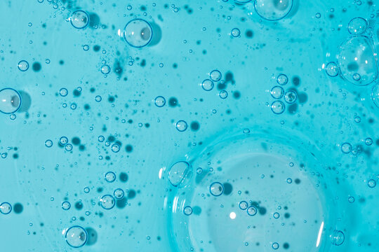 Blue gel texture with bubbles in abstract macro background