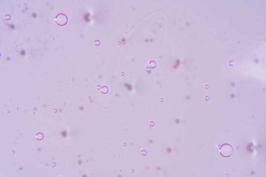 Purple gel texture with translucent bubbles abstract background