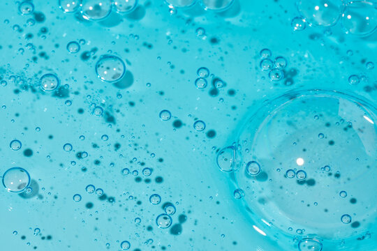Blue gel texture with transparent bubbles in closeup