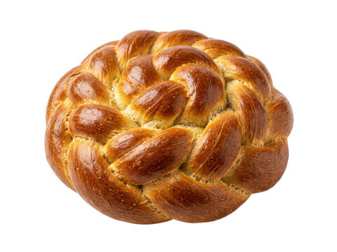 Fresh round braided challah bread loaf with poppy seeds on a wooden table surface