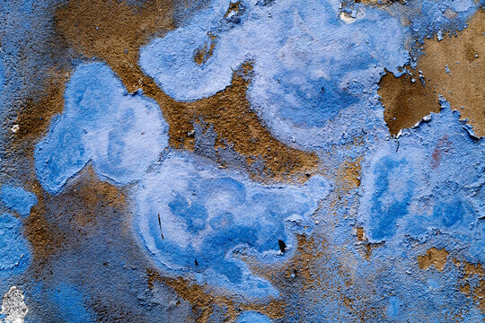 Weathered blue and brown peeling paint wall texture