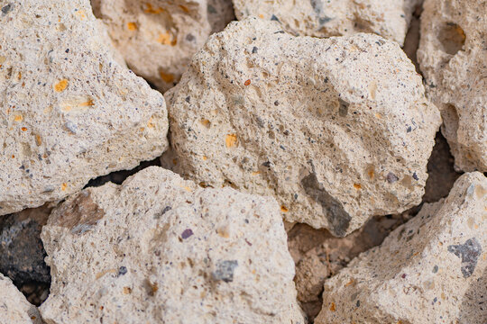 Weathered porous limestone rock texture background