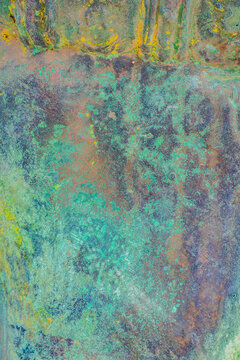 Abstract turquoise and ochre weathered surface texture
