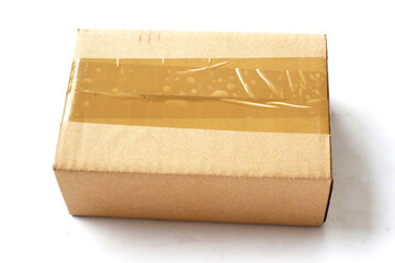 Brown cardboard box sealed with brown packing tape