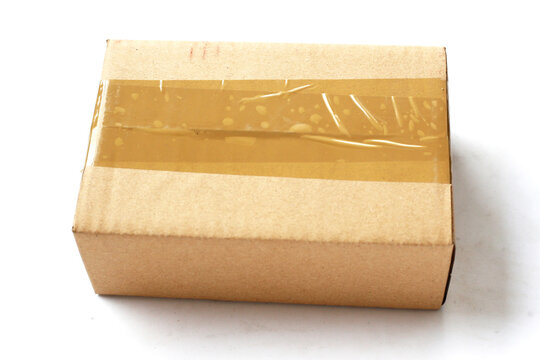 Brown cardboard box sealed with brown packing tape