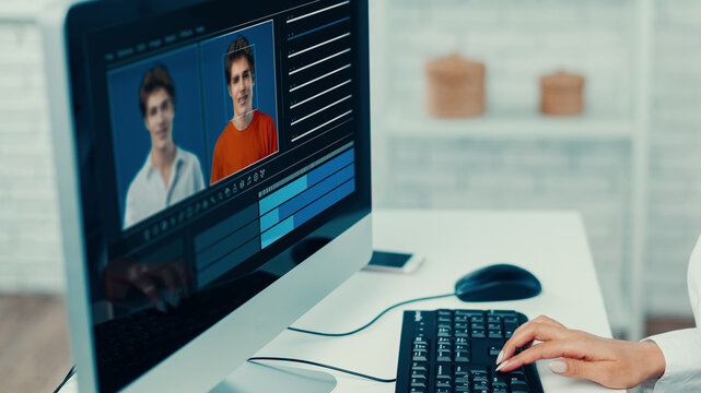 Editing a deep fake video on a computer with two faces and color settings displayed
