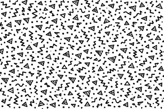 Hand drawn scattered abstract shapes and triangles doodle background pattern in black and white crayon style