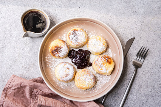 Ukrainian syrniki with blueberry jam