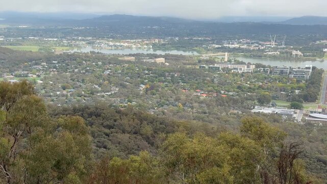A panoramic view from the famous Mount Ainslie Lookout over Canberra, with Anzac Parade's long, runway-like axis leading to Parliament House, Australian Capital Territory, Australia.