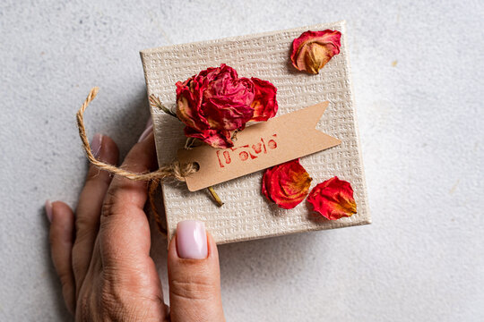 Handmade love gift box with dried red rose petals