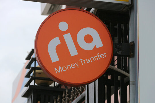 Ria Money Transfer corporate brand lightbox on street, international wire payments and currency exchange service emblem in Da Nang, Vietnam - January 23, 2026