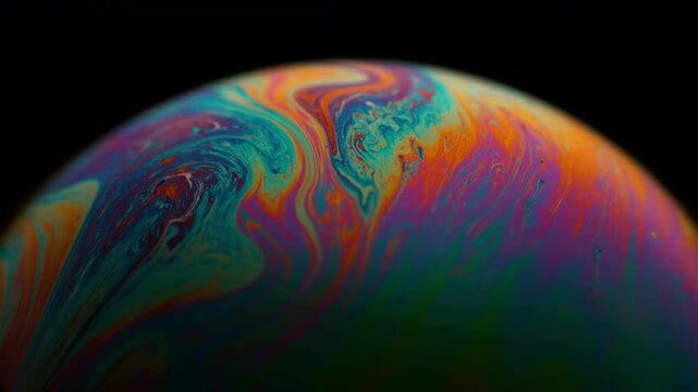 Macro Footage of a Colorful Soap Bubble with Bright Swirling Patterns in Super Slow Motion at 1000 fps