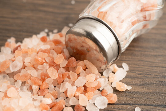 Sodium chloride Himalayan pink salt with salt shaker.