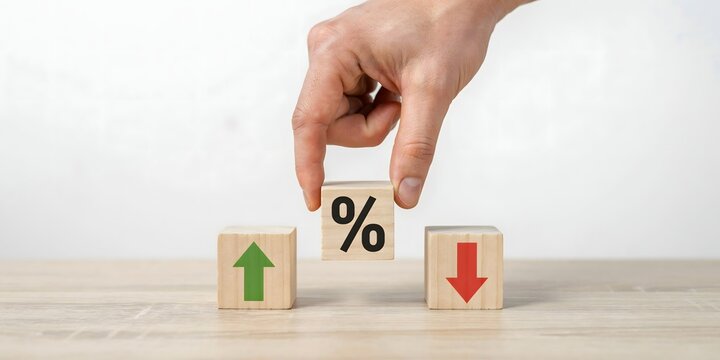Business Hand Placing Percentage Block Between Rising And Falling Arrows For Financial Growth And Market Change