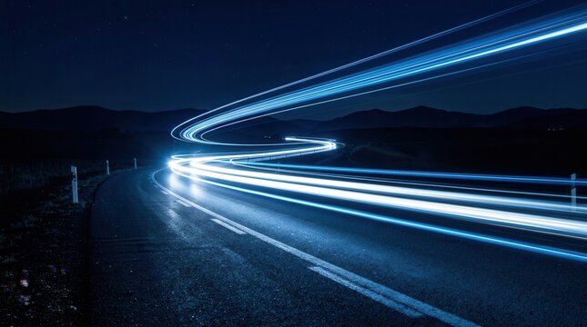 Abstract light trails of speeding cars on a night highway representing modern transportation and urban mobility.