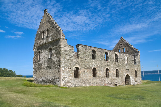 Historic Brahehus Castle Ruin with Stone Gables Under Blue Sky.