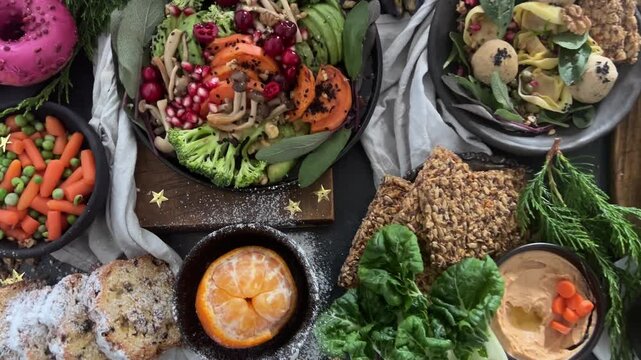 Christmas  family dinner with vegan snacks and dishes on a dark background. Vegan or gluten free diet