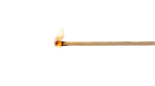 Burning matchstick ignites with a bright flame in close-up view on a white background
