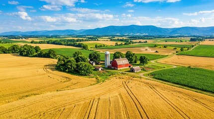 Obraz premium Rolling hills and a vast agricultural landscape under a sunny sky