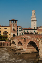Fototapeta premium Discover the charming architecture and historic bridges along the river in Verona, Italy