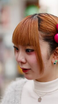 Japanese Woman with Orange Hair Laughing on Harajuku Street