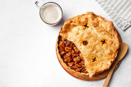 Beef steak pie with dark beer gravy and puff pastry crust