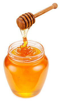 Honey dripping from honey stick into honey pot on a white background. File contains clipping path.
