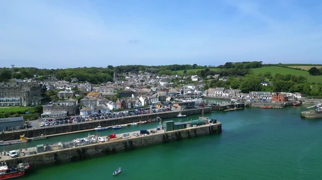 Padstow, Cornwall, England: DRONE VIEWS: The drone circles over the River Camel showing yachts, boats and trawlers moored inside Padstow harbour. The town of Padstow is renowned for its culinary links